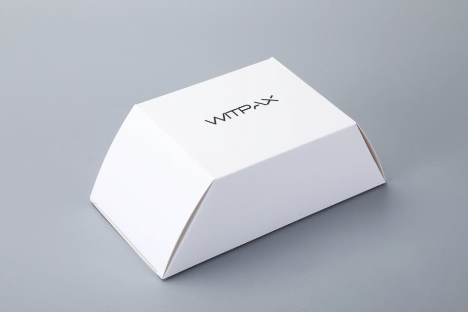 Trapezoidal folding carton